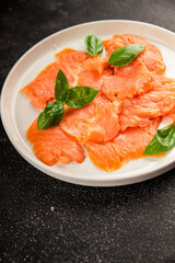 Smoked salmon fish seafood portion size natural product tasty snack fresh delicious gourmet food background on the table rustic top view copy space pescetarian diet