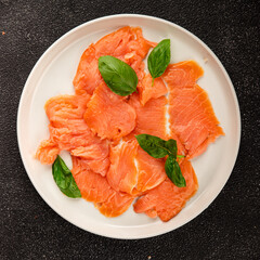 Smoked salmon fish seafood portion size natural product tasty snack fresh delicious gourmet food background on the table rustic top view copy space pescetarian diet
