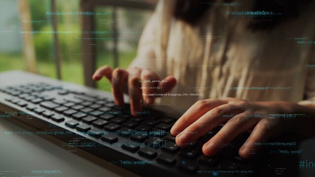 Close-up of hands typing on a keyboard with floating digital data in a bright workspace. The image reflects technology, innovation, and modern computing in action. Xenic