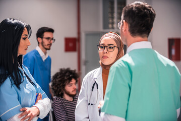 Medical Team Discussing Patient Care In Hospital Setting Diverse Doctors And Nurses Collaborating On Treatment Plans And Healthcare Solutions.