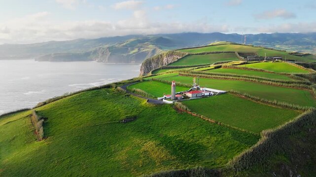 Aerial view of rocks coastline with lighthouse in Sao Miguel island Azores. Cliffs of San Miguel Acores island. Aerial view of Atlantic ocean coastline