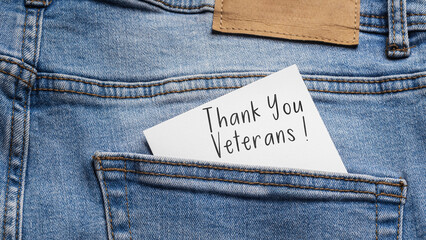 Thank You Veterans (Thank You Veterans!) - a white card inserted into the pocket of blue jeans, symbolizing memory and respect for military service.