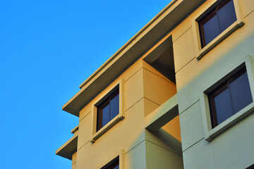Modern Building Exterior Against Clear Blue Sky – Architectural Detail