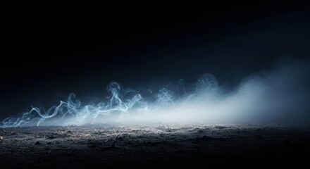 Mysterious blue smoke or fog hovering low over a dark, textured ground surface in darkness