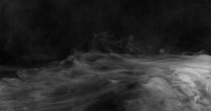 Super Slow Motion of White Surface Smoke Texture Isolated on Black Background. Filmed on High Speed Cinema Camera, 500fps. VFX element for overlay.