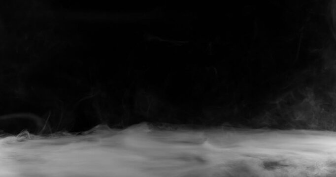 Super Slow Motion of White Surface Smoke Texture Isolated on Black Background. Filmed on High Speed Cinema Camera, 500fps. VFX element for overlay.