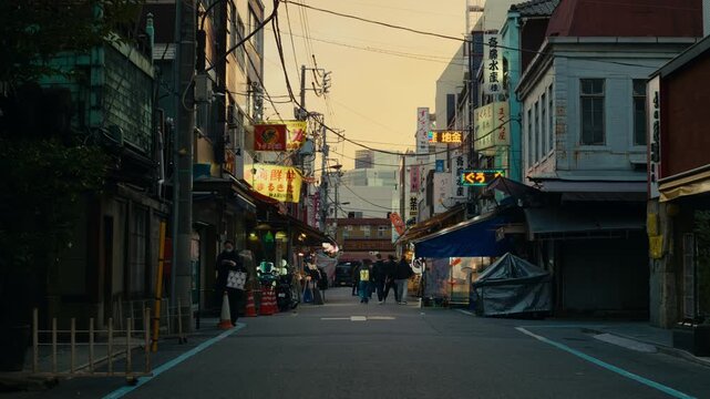 Blue hour mood on a Tokyo roadway with illuminated signs and urban detail.