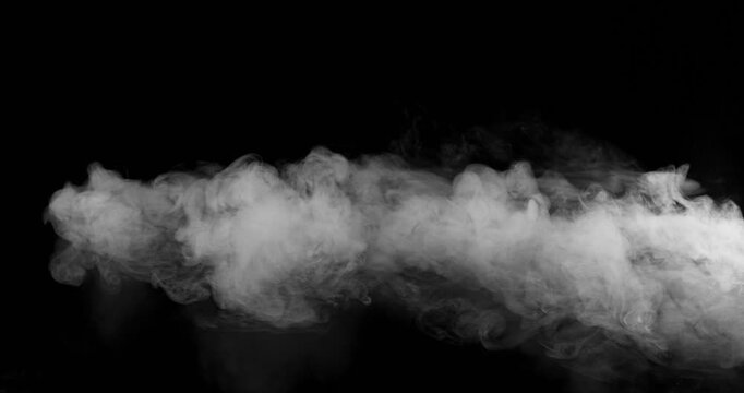 Super Slow Motion of White Surface Smoke Texture Isolated on Black Background. Filmed on High Speed Cinema Camera, 500fps. VFX element for overlay.