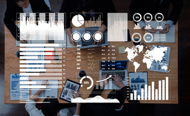 Professionals engage in a collaborative business meeting, analyzing data on laptops, with various charts and graphs displayed, highlighting global trends and insights. Axiom