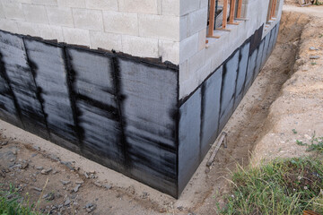 Waterproofing Application on House Foundation and Base