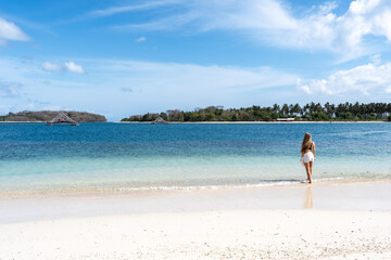 Woman enjoying tropical beach vacation lifestyle