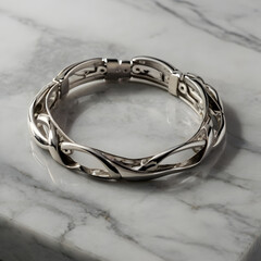 A luxurious silver bracelet showcases an elegant, intertwining design, symbolizing eternal connection, poised against a sophisticated marble surface.