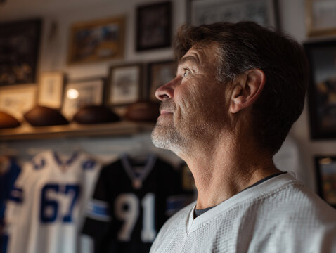 A sports memorabilia collector displaying jerseys, autographed balls, and vintage cards, highlighting their passion for sports history and rare finds.