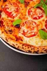 Pizza tomato margarita fast food natural product tasty snack fresh delicious gourmet food background on the table rustic top view copy space