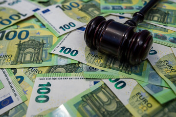 Euro banknotes with judge gavel, legal justice, regulation and business corruption concept