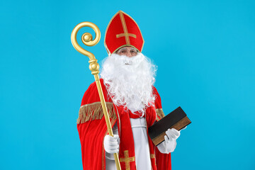 Saint Nicholas with book and crozier on blue background