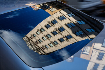 Reflection of Midtown Manhattan building in car window