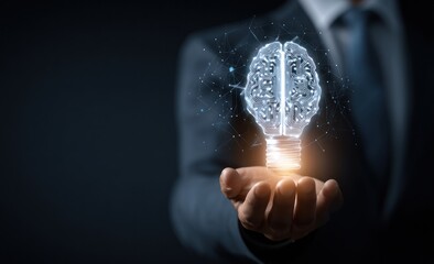 Businessman holds glowing digital brain lightbulb concept over dark background.