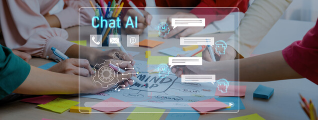 A diverse group collaborates on Chat AI development, engaging in brainstorming and mind mapping at a creative workspace, showcasing teamwork and innovation in technology. Trope