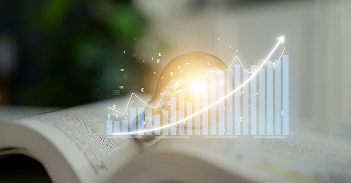 A light bulb shines above an open book as a graph symbolizes business growth, showcasing the blend of knowledge and financial success in professional settings. Impute