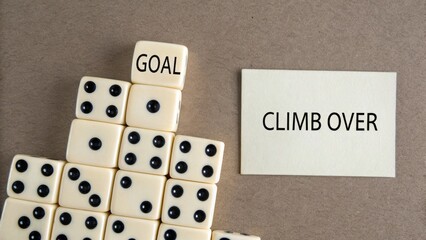 Domino pyramid with 'Goal' on top and 'Climb' card representing the journey to success