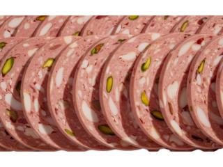 Slices of gourmet italian mortadella sausage with pistachios.