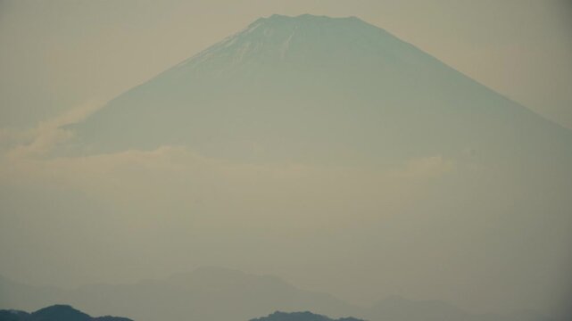 Tranquil twilight view of Mount Fuji from Chigasaki shoreline, Japan