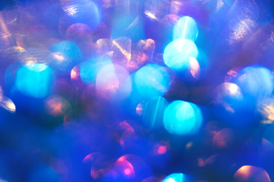 Abstract blue bokeh lights background with colorful orbs and soft glow for celebration