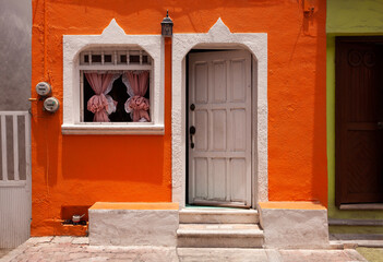 Fototapeta premium Colorful, brightly painted home in Isla Mujeres, Mexico 
