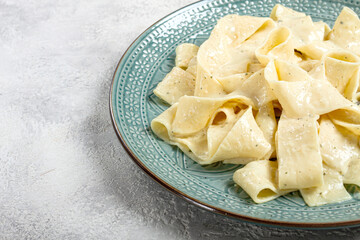 pasta papardelle in creamy garlic sauce, traditional Italian cuisine, pasta carbonara, homemade, no people,