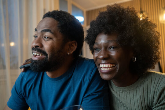 Honey, youre the best. Shot of a happy young couple feeling relaxed in the at home.