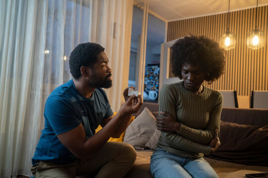 Emotional moment, black man on one knee as girlfriend refuses his proposal