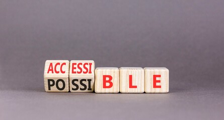 Accessible or possible symbol. Concept words Accessible or Possible on beautiful wooden blocks. Beautiful grey table grey background. Business accessible or possible concept. Copy space.