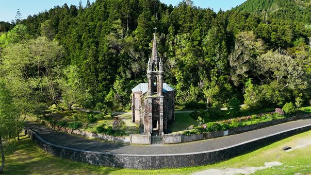 Aerial drone footage Capela de Nossa Senhora das Vitorias - old church chapel by the lake Furnas, Azores