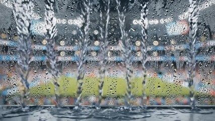 rainy stadium view from broadcast booth with water drops on glass - Powered by Adobe