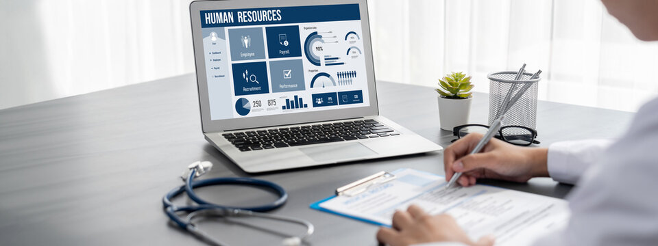 Human resources management software on computer screen helping human resources employee to manage recruitment, payroll, staff searching and KPI evaluation brisk