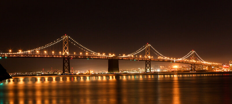 Night San Francisco Bay Bridge Reflections Calm Waterfront Travel Architecture - Powered by Adobe