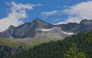 Mountains at the Malga Bissina reservoir in Trentino, Italy.