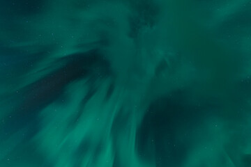 Green aurora borealis lighting up the northern sky over Sweden