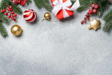 Christmas present, balls and fir tree branches.