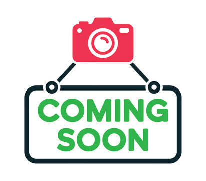A red camera icon hangs above a green and black "Coming Soon" sign, indicating an upcoming event or product launch.
