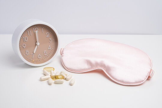 Sleep mask, alarm clock, and supplements for restorative health. Scheduled wellness.