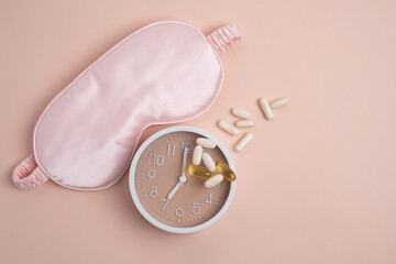 Sleep mask, alarm clock, and supplements for restorative health. Scheduled wellness.