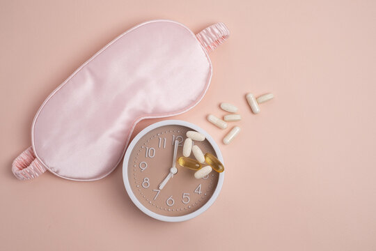 Sleep mask, alarm clock, and supplements for restorative health. Scheduled wellness.