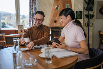 Business colleagues discussing project during coffee break