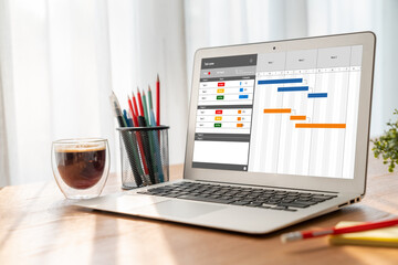 Project planning software for modish business project management on the computer screen showing...