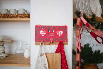 Christmas countdown calendar and festive Christmas paper chain decorations in a rustic kitchen