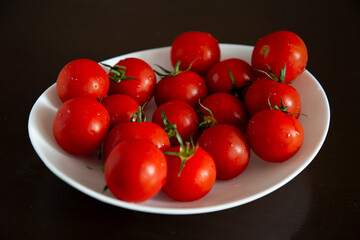 View of a white plate with tomatoes
