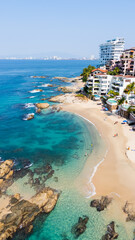 Majestic tropical beach in Puerto Vallarta Mexico with the city in the background