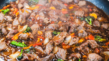 Beef cubes with broccoli, onions, and bell peppers bubbling in savory soy sauce. Smoking hot, perfect for rice bowls or main dish.